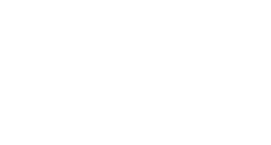 Dentist in white coat examining patient in dental chair at Uptown Dental Associates office